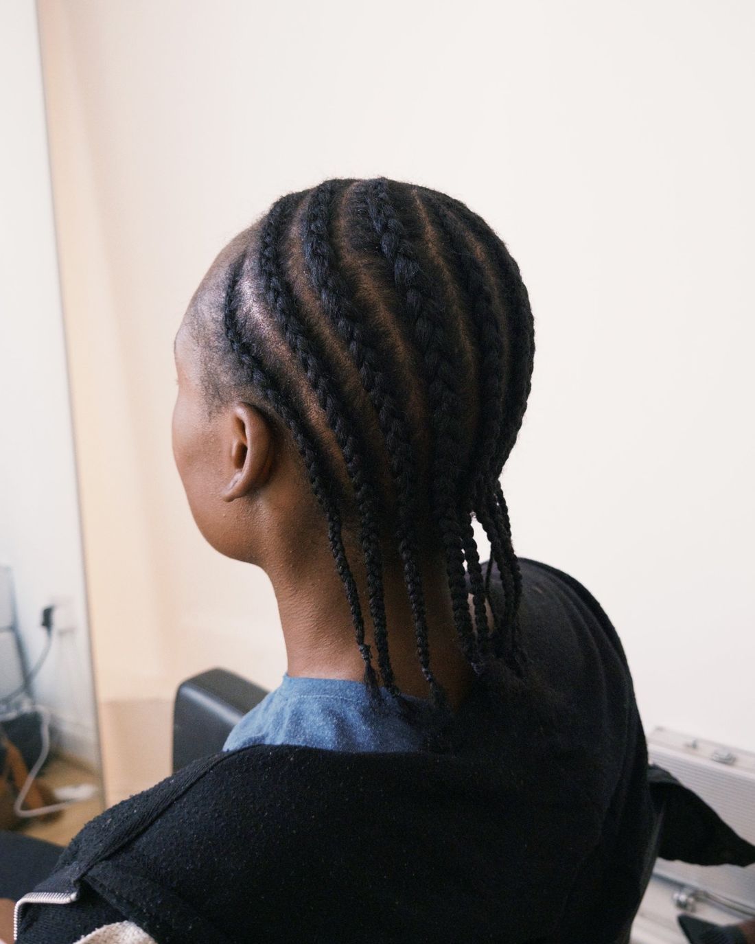Finished natural cornrows, seen from behind